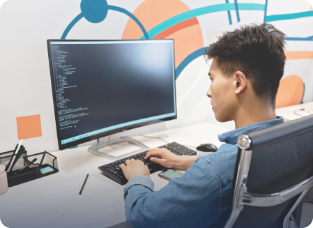 Student working at a computer in an AI lab